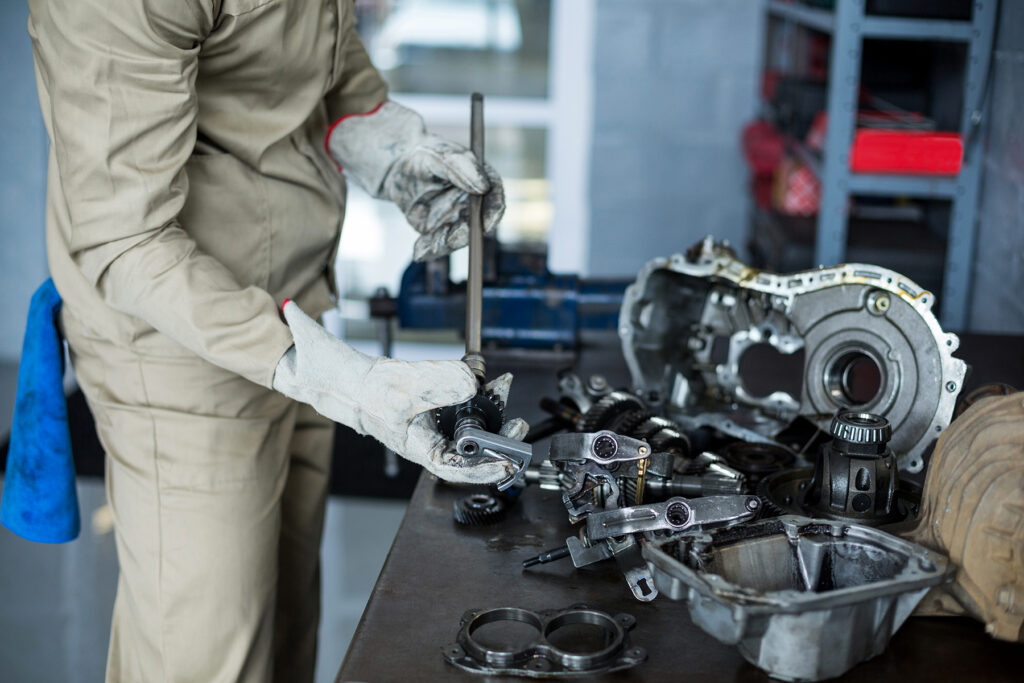 mechanic checking a car parts